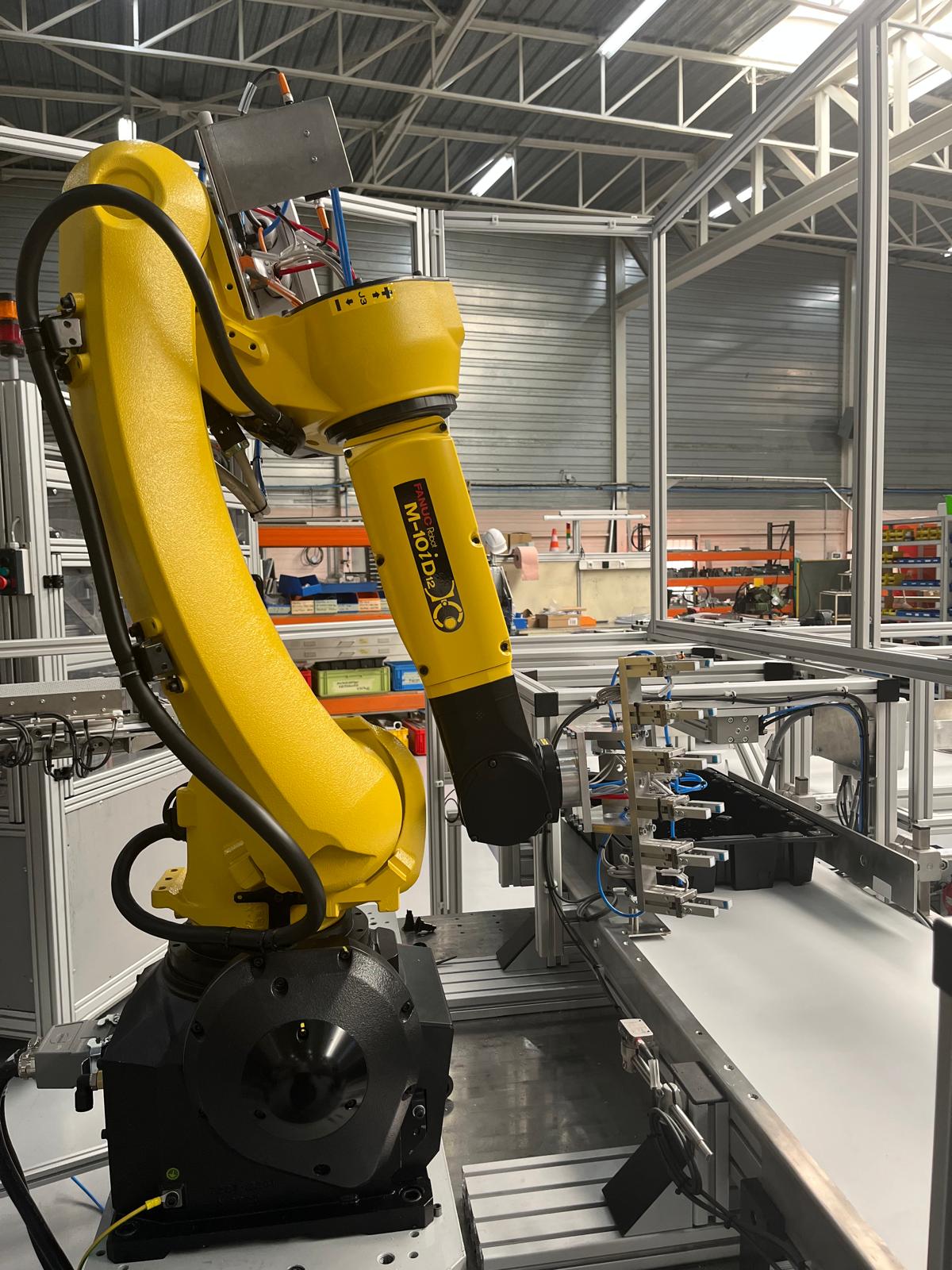 Îlot robotisé Fanuc pour flacons de parfums